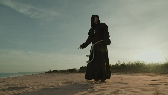 Monk Does Jump Rope Sport Training On The Sand Dunes