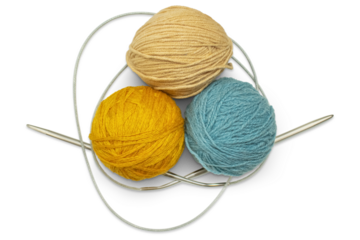 Several multi-colored skeins of wool yarn with knitting needles, isolated on a transparent background. Hobby, handicraft concept.