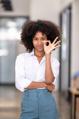 Obraz premium black woman making hand sign OK , signs and symbols, body language
