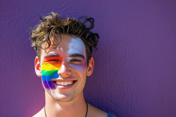 Happy smiling man, rainbow LGBT pride flag face paint in LGBTQ celebration parade fun party