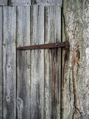 old wooden door with rusty latch with negative space