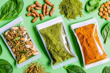 Superfood Powders and Herbal Supplements on Green