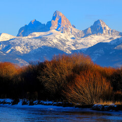 Grand Tetons Mountain Range Teton Mountains with Snow and Sunset Light with River & Ice