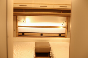 Interior design of a bed room in a camper. Caravan, motorhome. Mobile home. Furniture