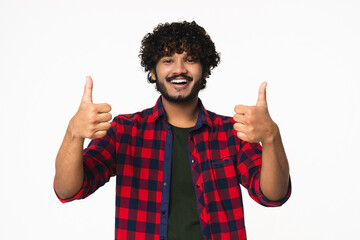 Cheerful young Indian man showing thumbs up isolated over white background. Handsome Hindi boy in...