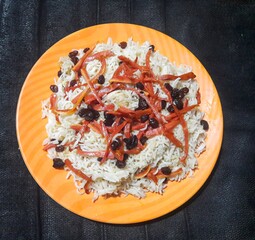 Kabuli pulao afghani pulao in a plate rice plate famous Asian dish isolated on black background 
