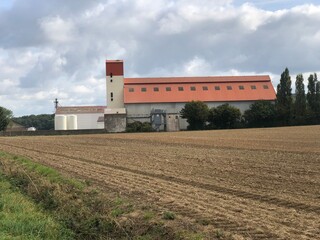 Agricultural silo and processing unit close to the fields in Picardy Marquéglise Hauts-de-France France. - 775058578