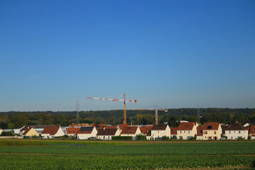 Growing rural village. Country crane