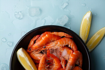 Prawn dish accented with lemon, seafood restaurant promotions or cooking show segments concept.