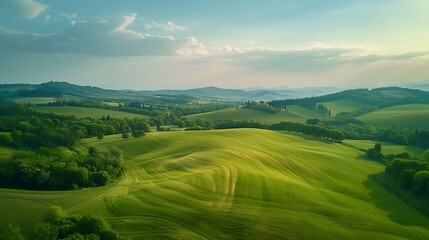 An aerial view of a picturesque countryside with rolling hills and farmland