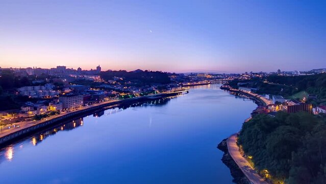 Aerial panoramic view before sunrise at the most emblematic area of Douro river timelapse night to day transition. World famous Porto wine production area.