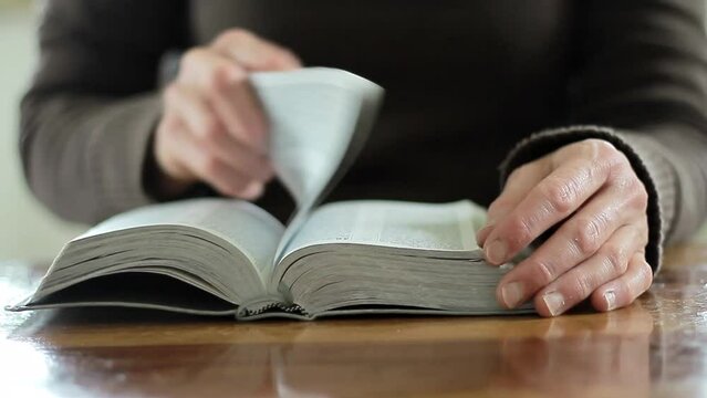 praying to God with the bible on black background with people stock footage stock video