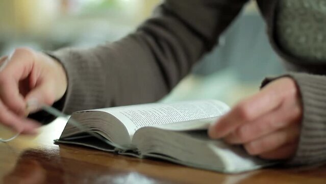 praying to God with the bible on black background with people stock footage stock video