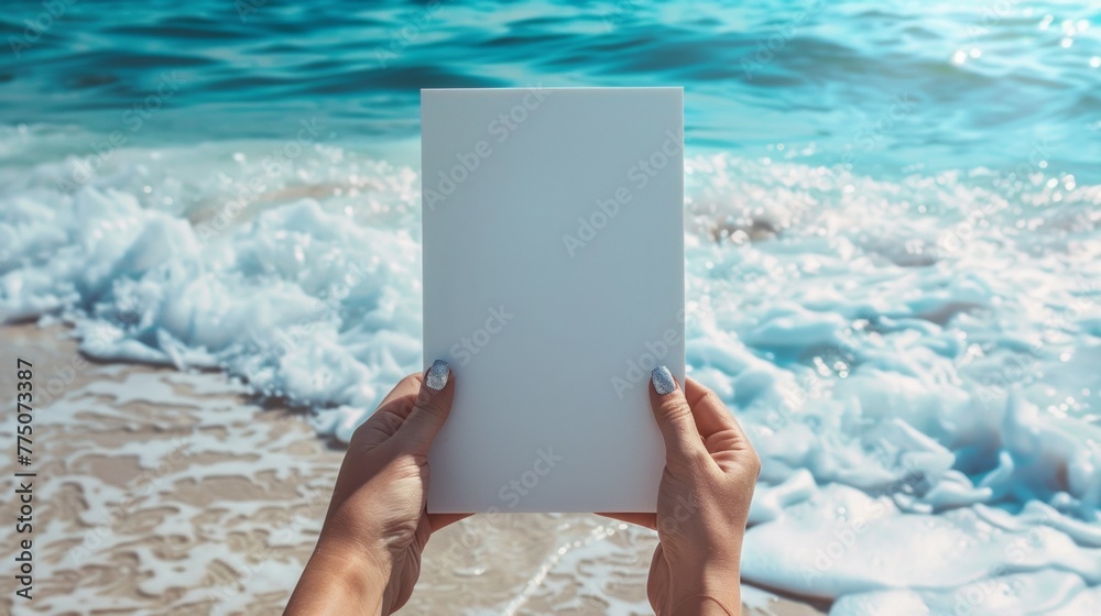 Canvas Prints A person holding a blank white piece of paper on the beach, AI