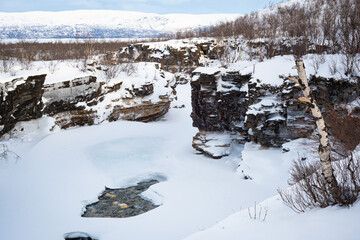 Rocky landscape of the Abisko gorge, Sweden in the snow