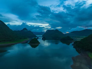 Cercles muraux Guilin Summer lake in Oriental Guilin, Hainan, China, is burning with clouds