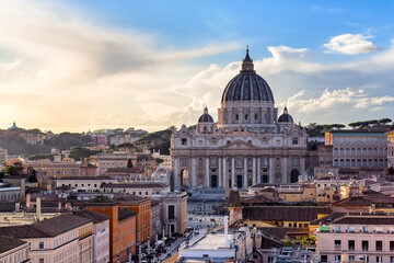 Saint Peter Basilica in Vatican City at Rome, Italy and Street Via della Conciliazione at sunset sky.