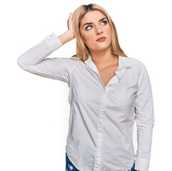 Young caucasian woman wearing casual clothes confuse and wondering about question. uncertain with...