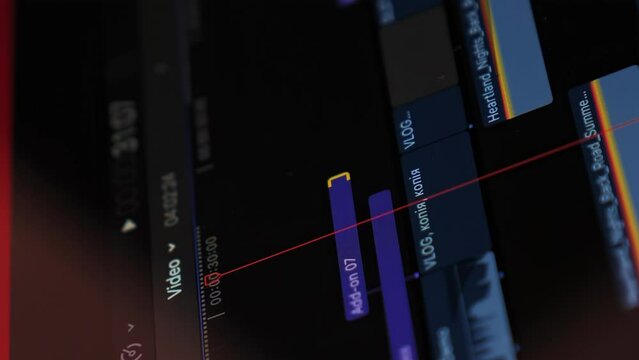 Filmmaker editing video footage on computer, close up of display. Vertical video