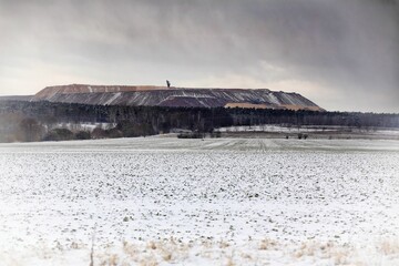 Mining waste dump and field in wintertime in Germany