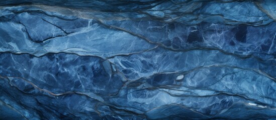 Detailed view of a textured rock wall with a striking blue marble pattern, showcasing intricate natural formations
