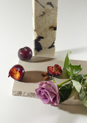 The plum lies on a decorative designer stone