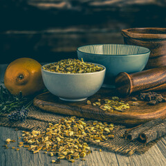 Orange Peel on wooden table background. Herbs, spices and dried food baking ingredient. Mortar and...