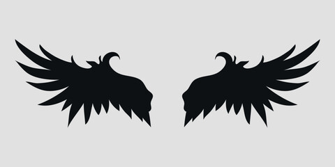 Black wings of an angel are hand drawn. Vector on a gray background	
