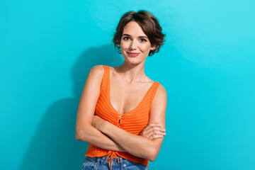 Photo of friendly adorable woman with bob hairstyle dressed knitwear singlet holding arms crossed...