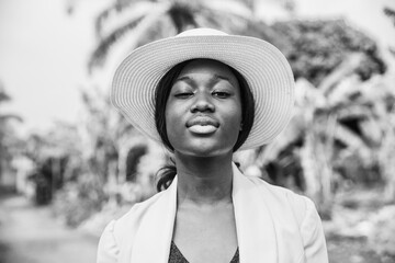 Black and white portrait of a young African businesswoman with confident gaze