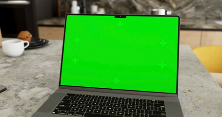 Laptop place on room table, Green screen display, Close up monitor of notebook with mock up - 775112752