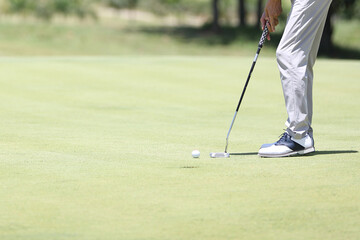 Close up golf ball on green grass