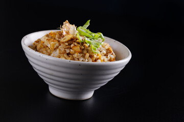 Japanese fried rice yakimeshi isolated in black background - 775119706