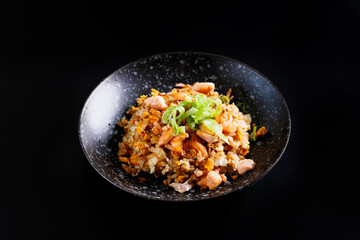 Japanese fried rice yakimeshi isolated in black background - 775119709