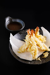 Shrimp tempura Japanese food isolated on a black background - 775120929