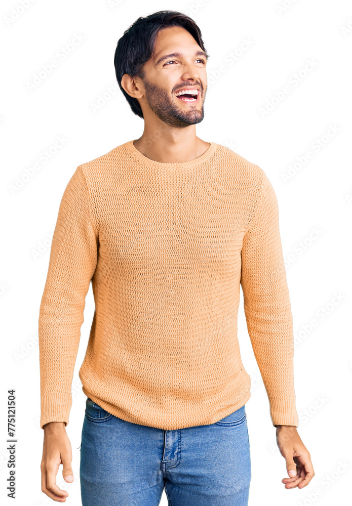 Poster Handsome hispanic man wearing casual sweater looking away to side with smile on face, natural expression. laughing confident.