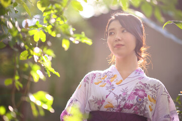 portrait woman with yukata dress in the garden - 775122365