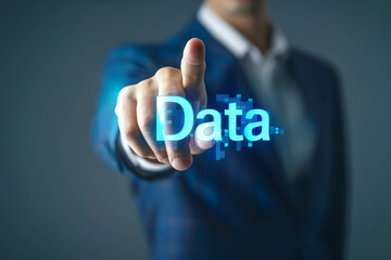 Businessman stand behind and pointing in to word “Data”, digital information in the online world or network technology