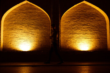 Khajoo bridge at night, across the Zayandeh River in Isfahan, Iran.