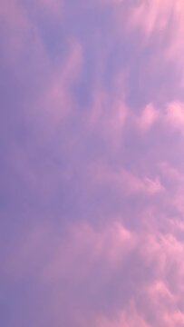 Cotton Candy Cloudscape. Light and feathery pink morning clouds that look like cotton candy. Beautiful soft abstract pink background.