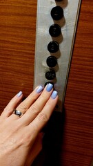 Woman hand pressing the button in elevator inside the building. People photo. 