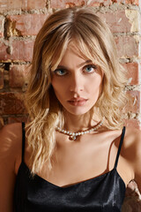 A woman in a black dress posing for a picture