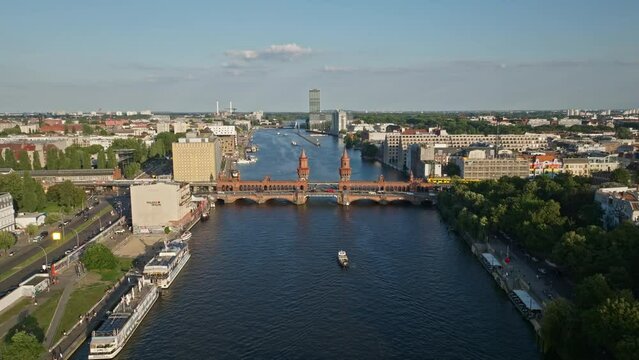 Aerial Drone shot of a train crossing The Oberbaum Bridge (Oberbaumbr&uuml;cke) . It is a double-deck bridge crossing Berlin's River Spree, considered one of the city's landmarks. 