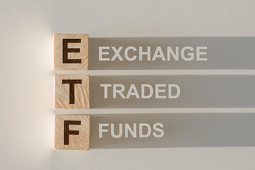 ETF - Exchange Traded Fund text on wooden cubes, on white background