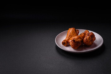 Delicious chicken legs baked on the grill with salt, spices and herbs