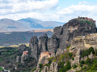 Fototapeta na wymiar Meteora Monasteries and the surrounding rock formation on a partly cloudy day 10