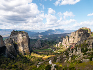 Fototapeta na wymiar Meteora Monasteries and the surrounding rock formation on a partly cloudy day 13
