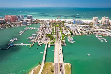Foto auf Acrylglas Clearwater Strand, Florida Florida beaches. Clearwater Beach Florida. Panorama of city. Spring or summer vacations. Beautiful view on Hotels and Resorts on Island. Blue color of Ocean water. American Coast. Gulf of Mexico shore