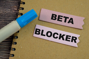Concept of Beta Blocker write on sticky notes isolated on Wooden Table.
