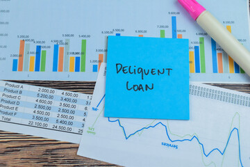 Concept of Deliquent Loan write on sticky notes isolated on Wooden Table.